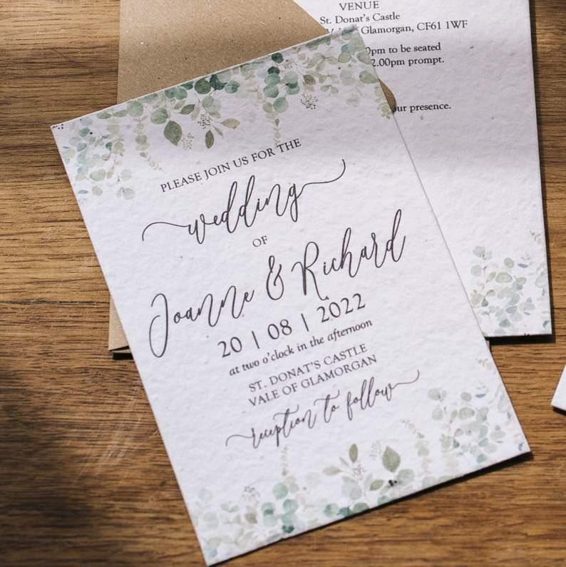 Alt Text: Green Manatee’s recycled paper wedding invitation