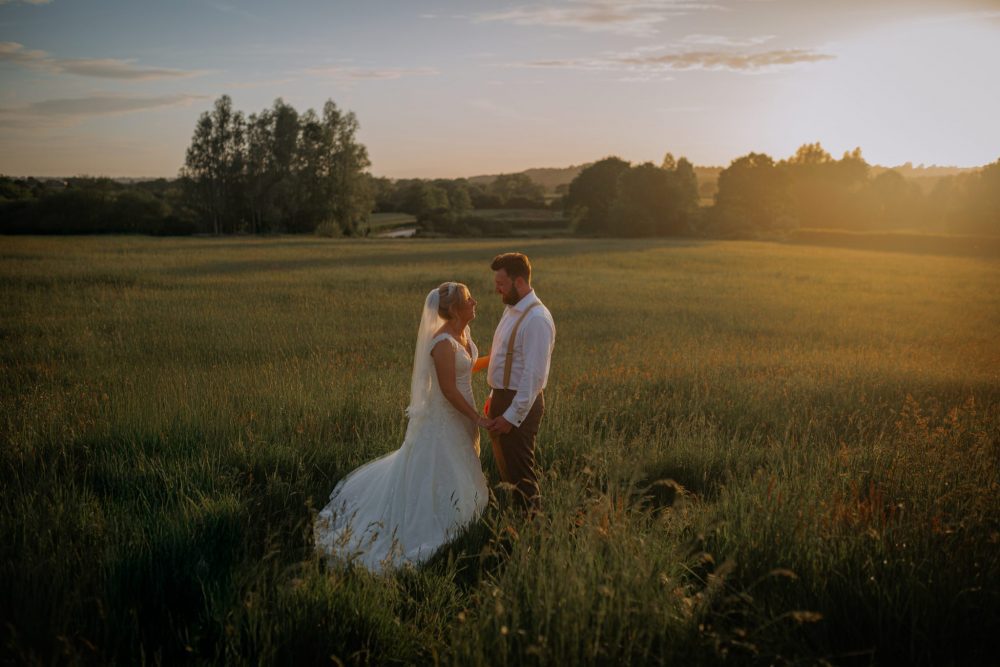 bridal couple in field