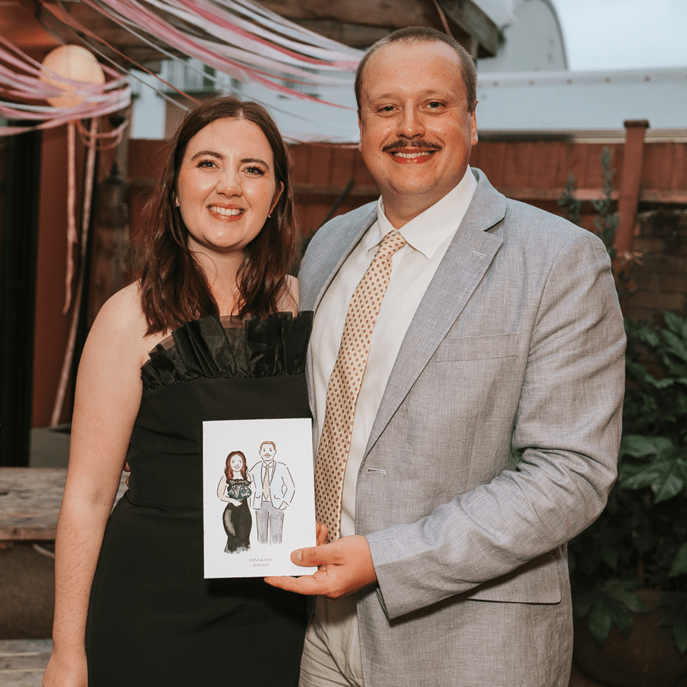 Couple with their live wedding illustration of themselves