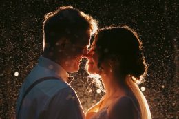 bride and groom with sparkly bsckground