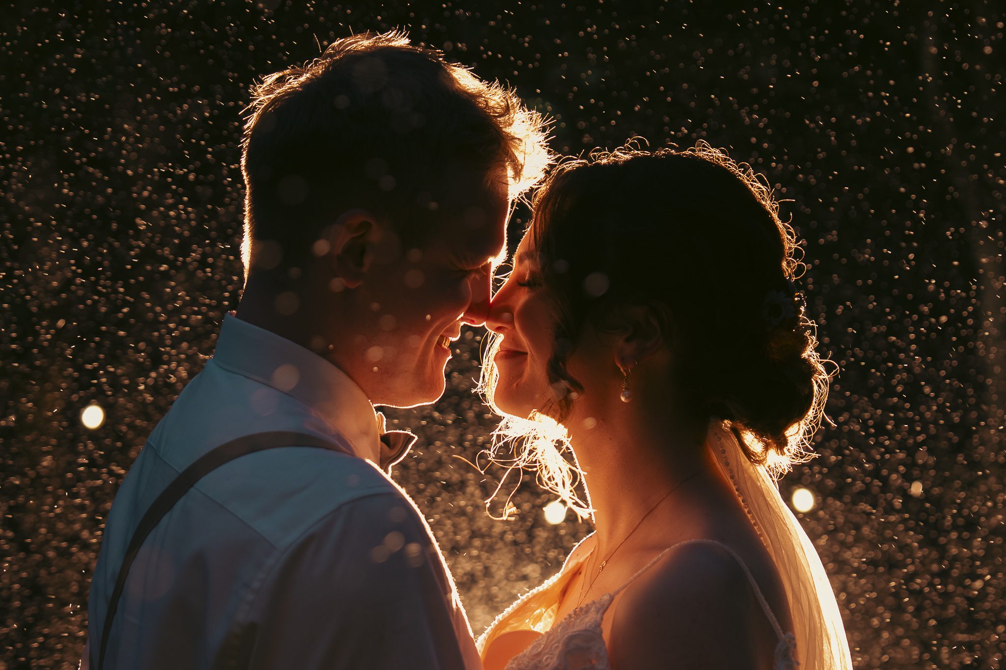 bride and groom with sparkly bsckground