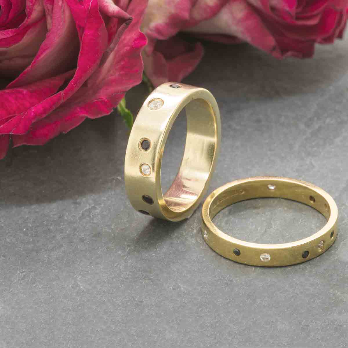 wedding bands with black and white scattered diamonds