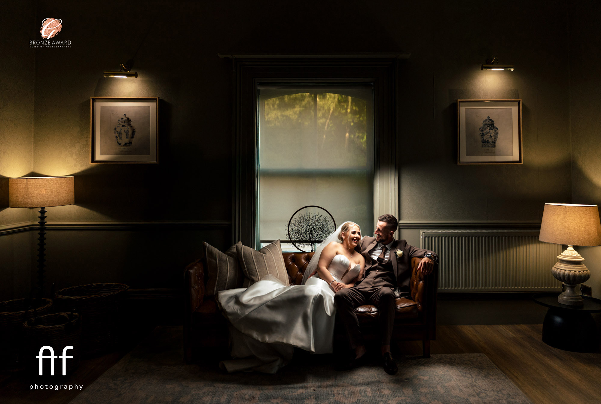 Bride and groom on sofa
