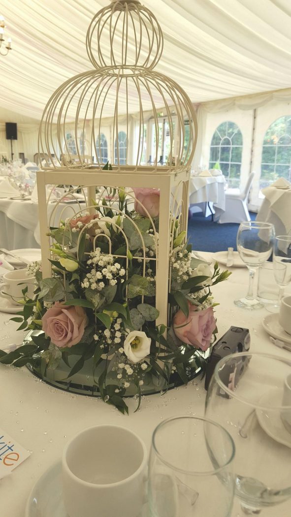 birdcage decorated with flowers for wedding