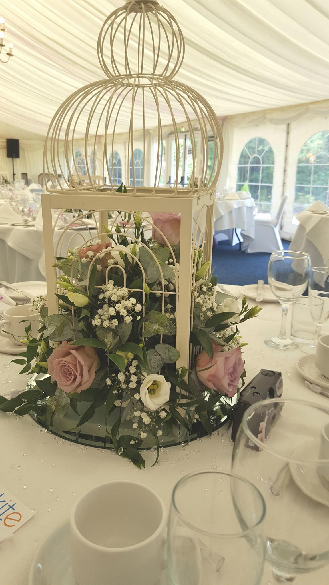birdcage decorated with flowers for wedding