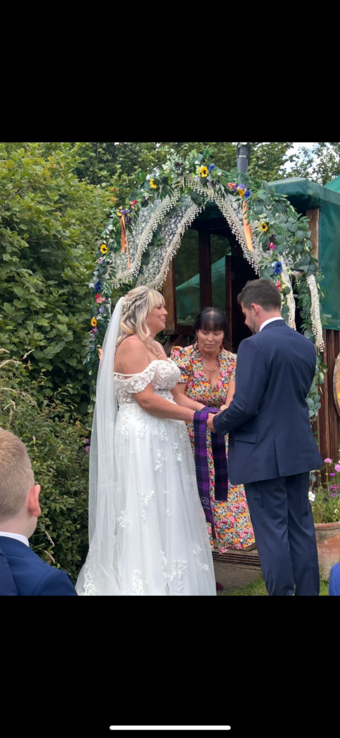bridal couple handfasting with celebrant