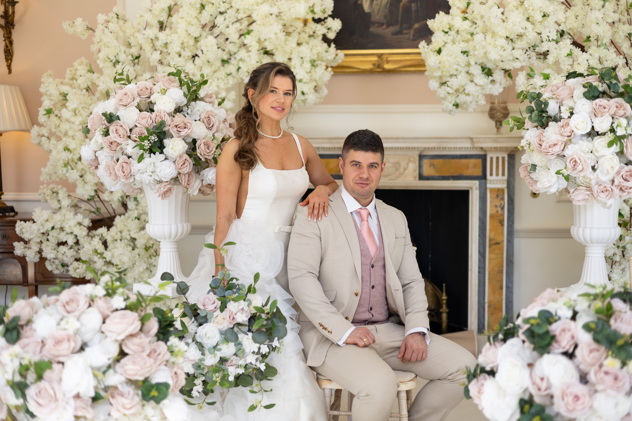 Editorial luxury wedding styling at Bowcliffe Hall featuring blush and ivory floral urns, statement blossom trees, romantic ceremony florals and timeless bridal portrait inspiration by Love Stories Events. Luxury Yorkshire wedding stylist specialising in wedding decor hire, floral installations, manor house wedding styling, romantic ceremony design, Bowcliffe Hall weddings, Leeds wedding decor, Harrogate wedding stylist and editorial wedding inspiration.