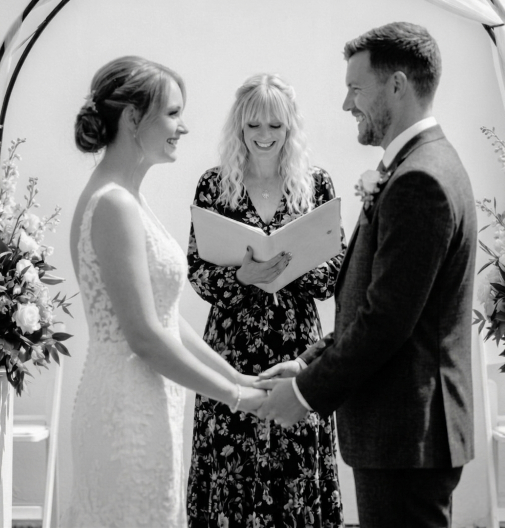 celebrant with bridal couple