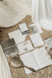 Luxury wedding stationery for a destination wedding in Sicily featuring bespoke invitations, silver foil details and bridal accessories.