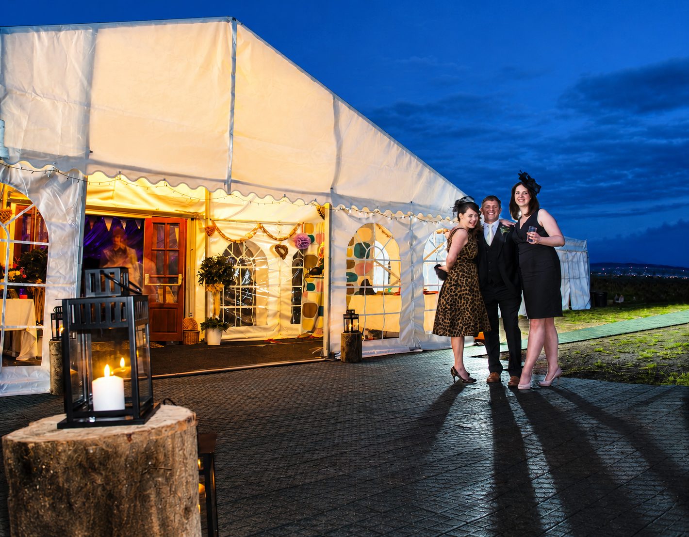 Bradford outdoor wedding marquee set in a Yorkshire country garden surrounded by greenery and floral details.