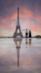 Couple with Eiffel Tower at dusk