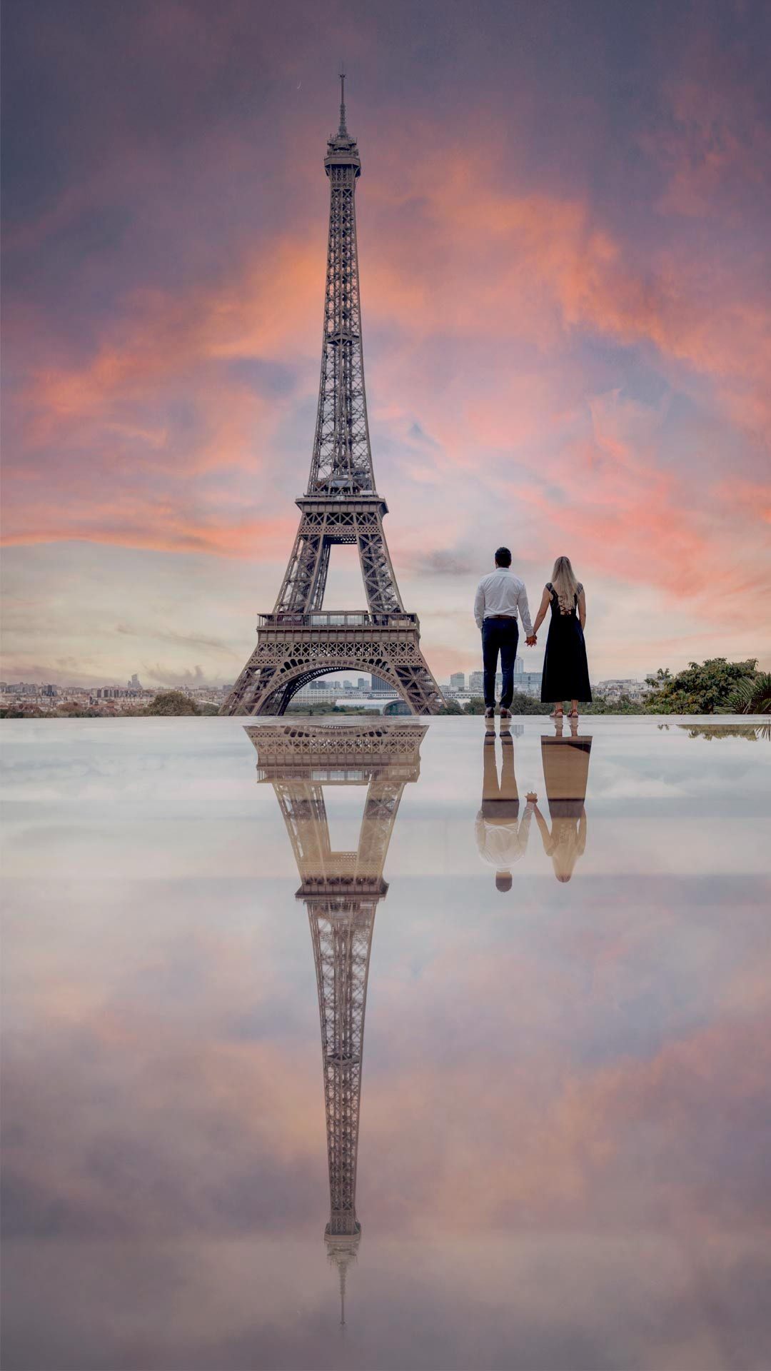Couple with Eiffel Tower at dusk